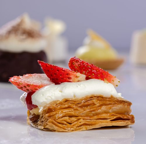 cake tart with strawberry on top.