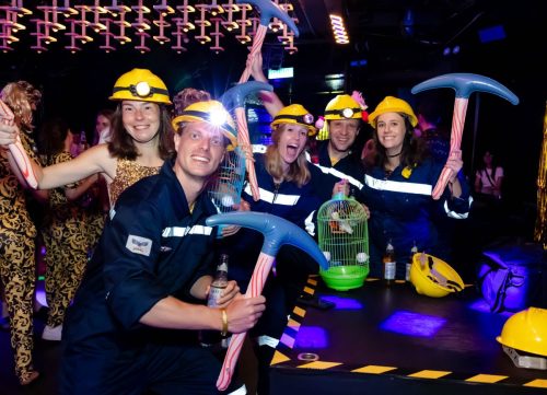 A group of Australians with their construction worker costumes.