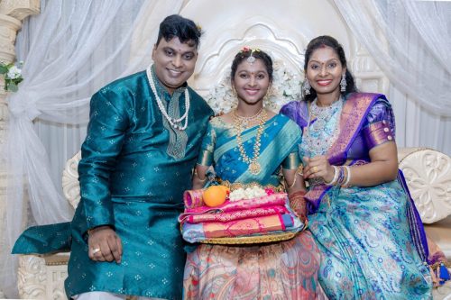 Indian Daughter celebrating her Puberty with her Mom and Dad.